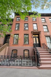 front view of a brick house with a door