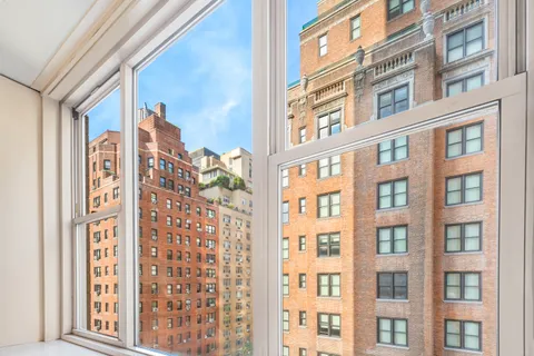 a front view of a building with a bunch of windows