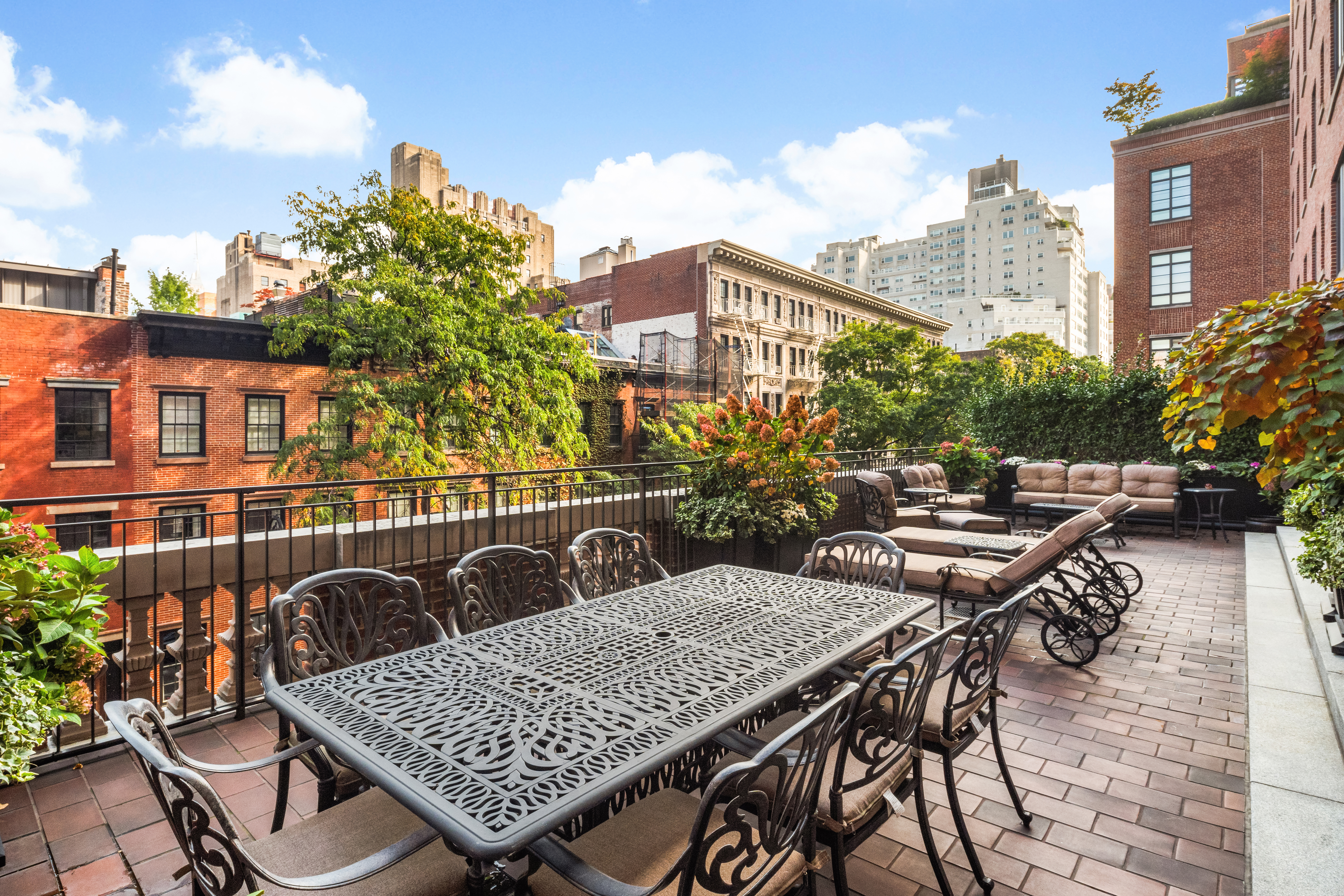 150 West 12th Street, Unit 3WEST Manhattan, NY 10011 - Photo 14 of 39 a view of a roof deck with couches and potted plants