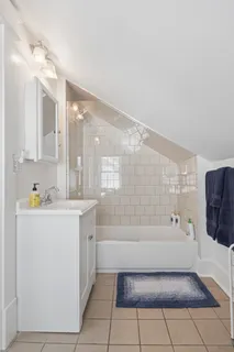 a front view of house with yard and outdoor seating