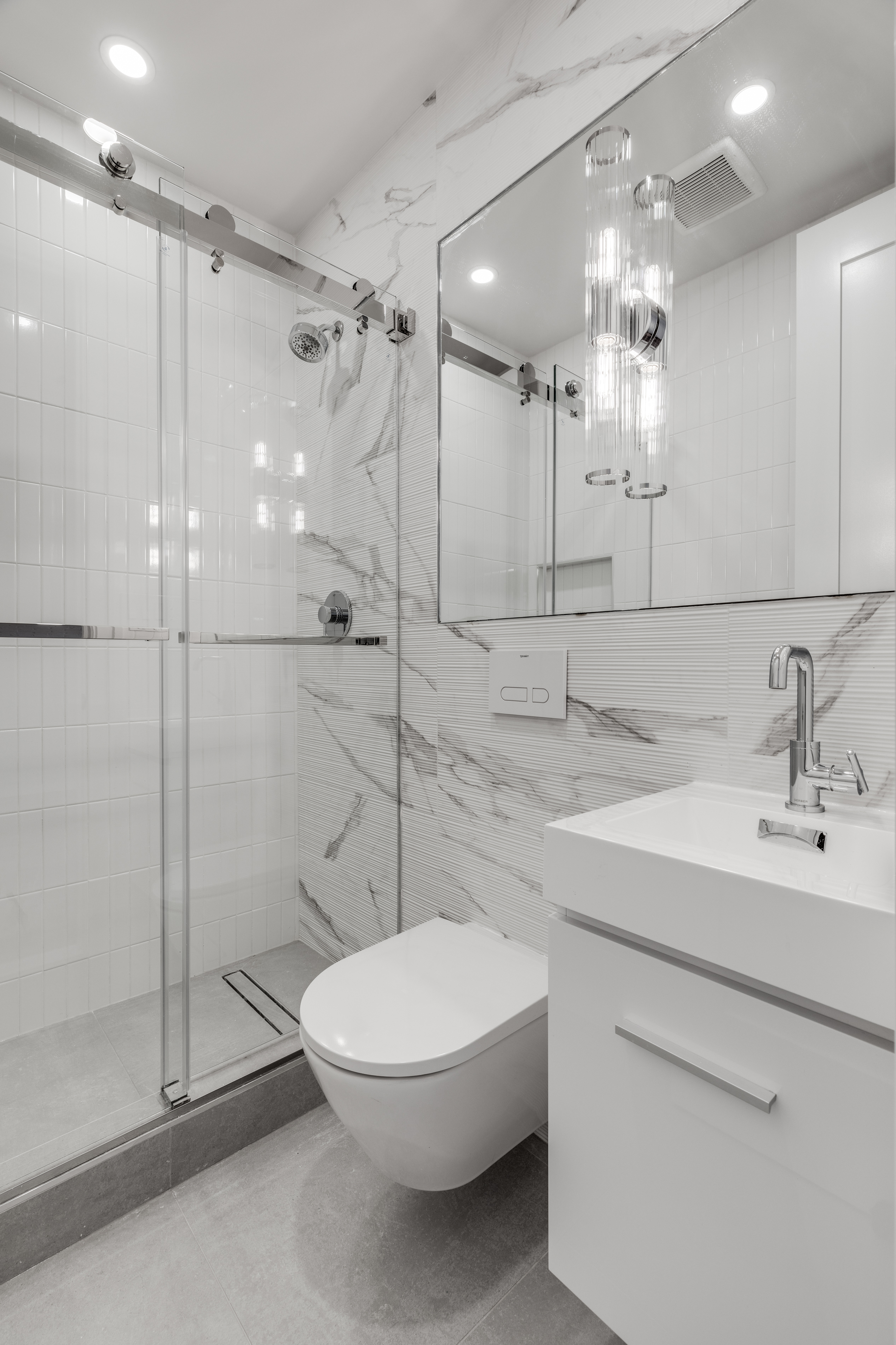 14 Bedford Street, Unit 7 Manhattan, NY 10014 - Photo 4 of 5 a bathroom with a sink a toilet and shower