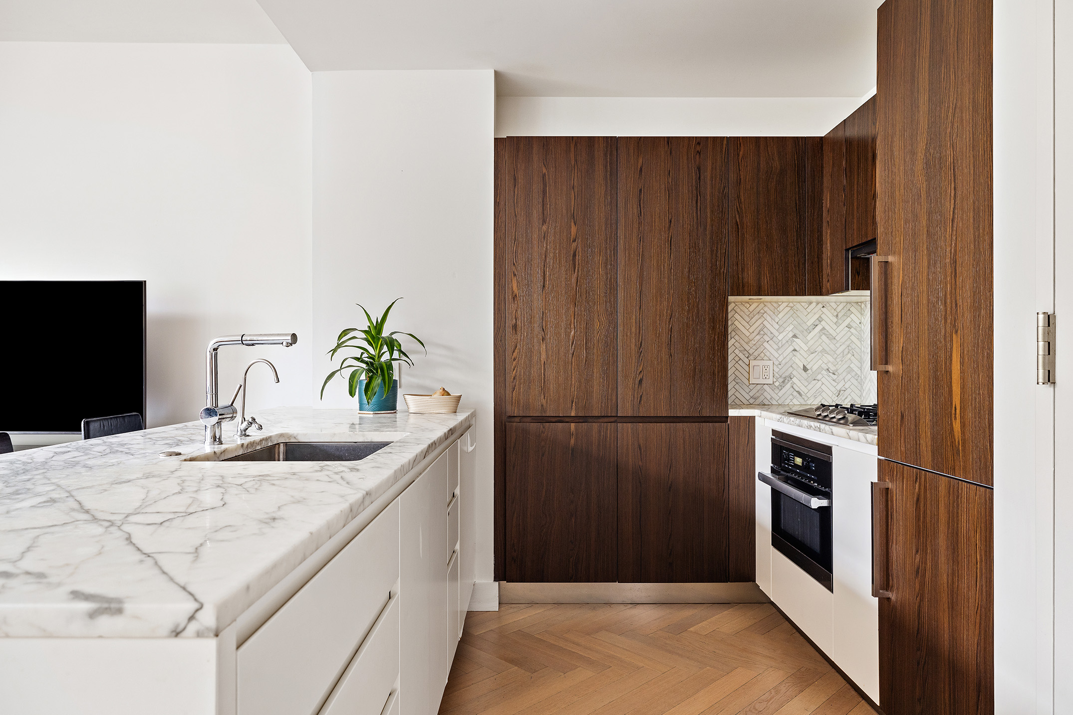 100 Avenue A, Unit 4B Manhattan, NY 10009 - Photo 6 of 12 a kitchen with kitchen island a counter top space and stainless steel appliances