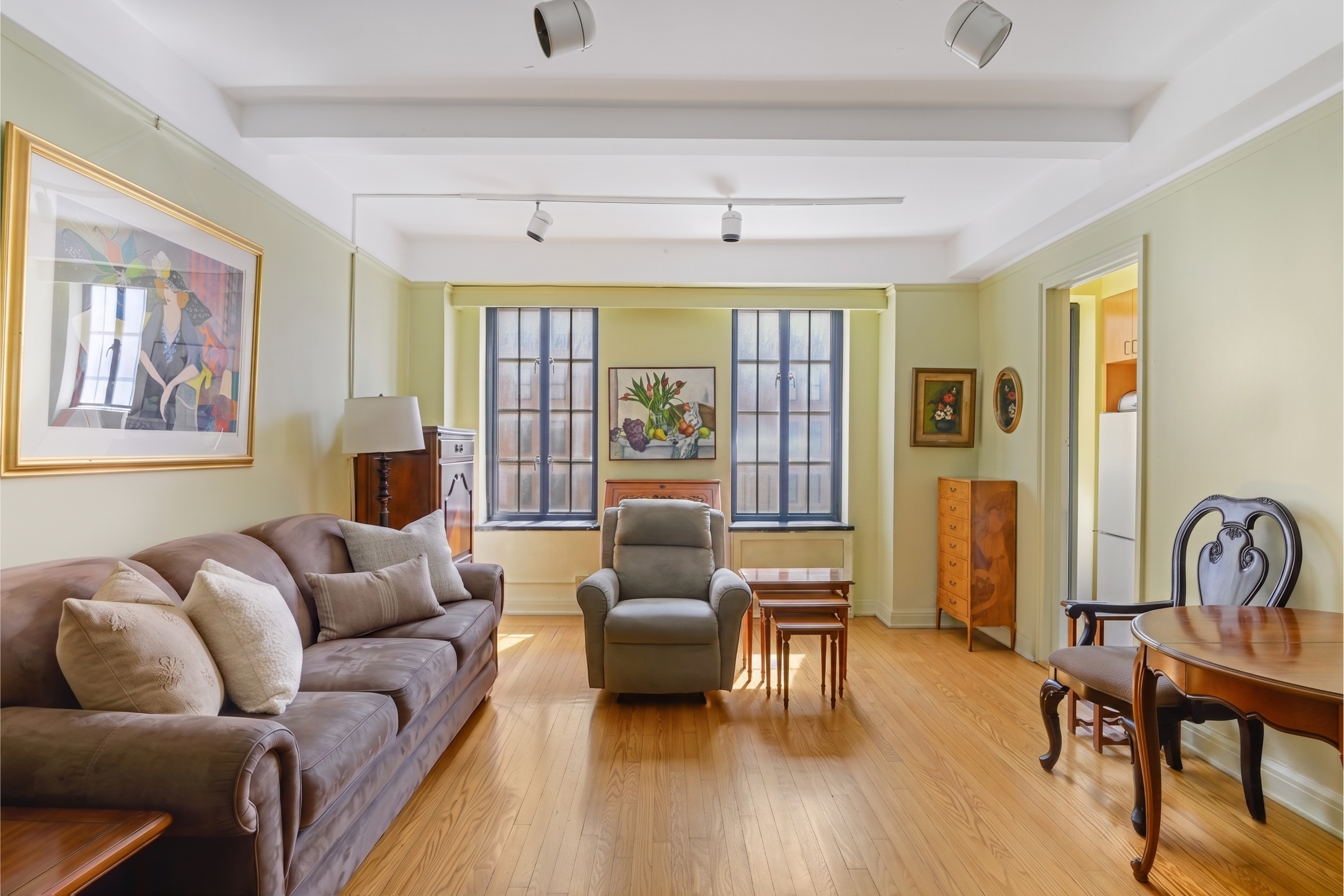 201 West 16th Street, Unit 3C Manhattan, NY 10011 - Photo 1 of 11 a living room with furniture and a large window