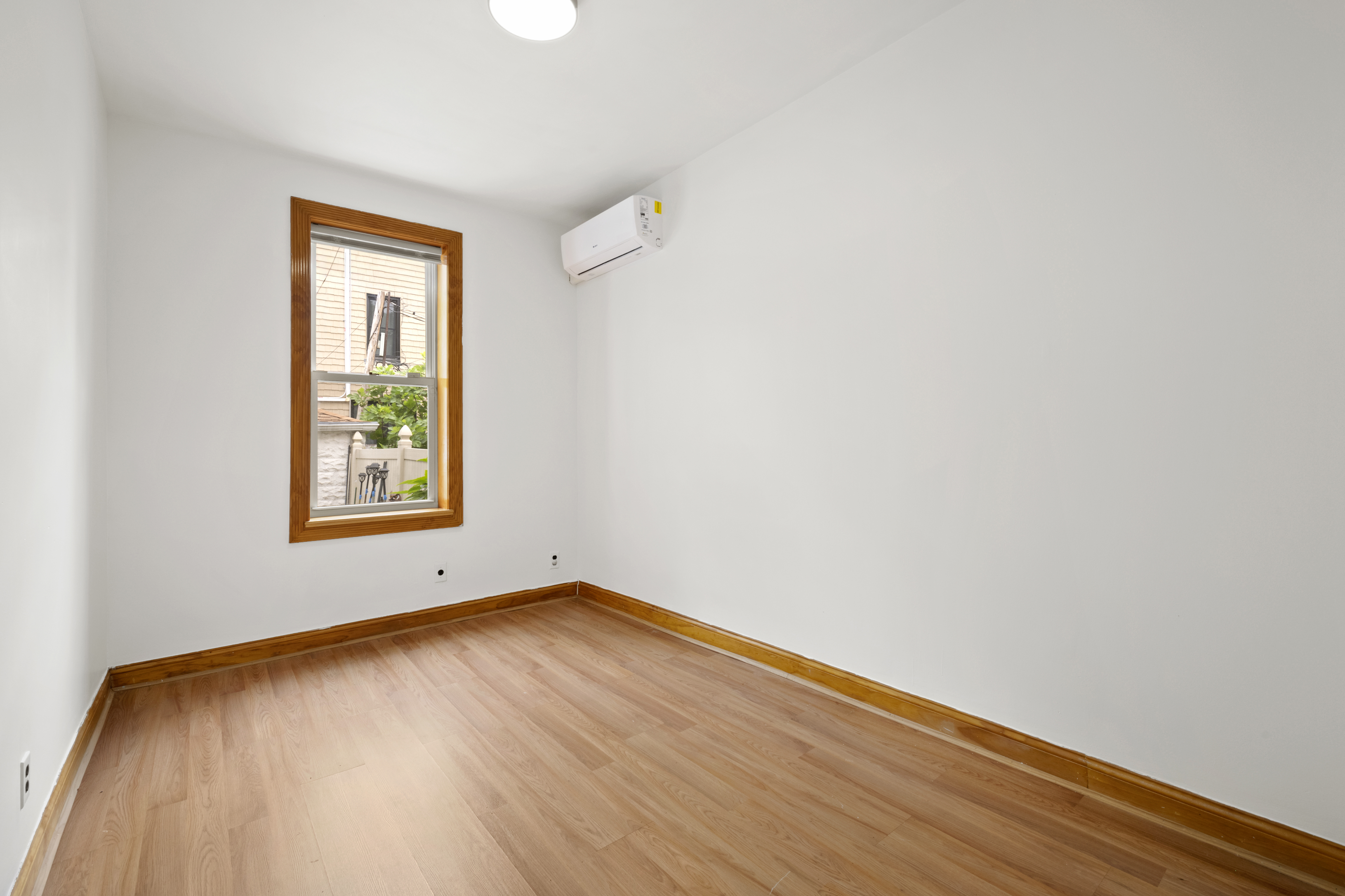 95 Chester Avenue, Unit 1 Brooklyn, NY 11218 - Photo 9 of 13 an empty room with a window