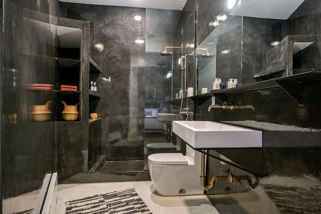 459 Harman Street, Unit 1 Manhattan, NY 10026 - Photo 7 of 17 a bathroom with a sink a toilet and shower