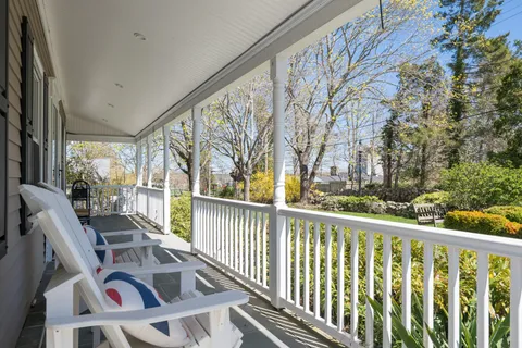 a view of balcony with furniture