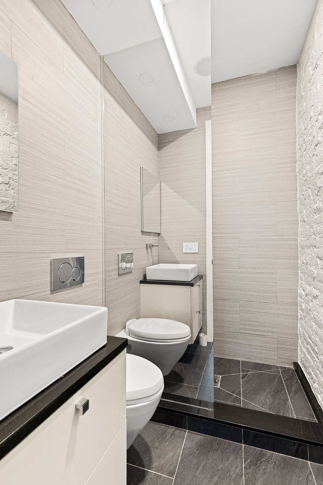 57 Thompson Street, Unit 2CD Manhattan, NY 10012 - Photo 10 of 13 a bathroom with a sink a toilet and shower