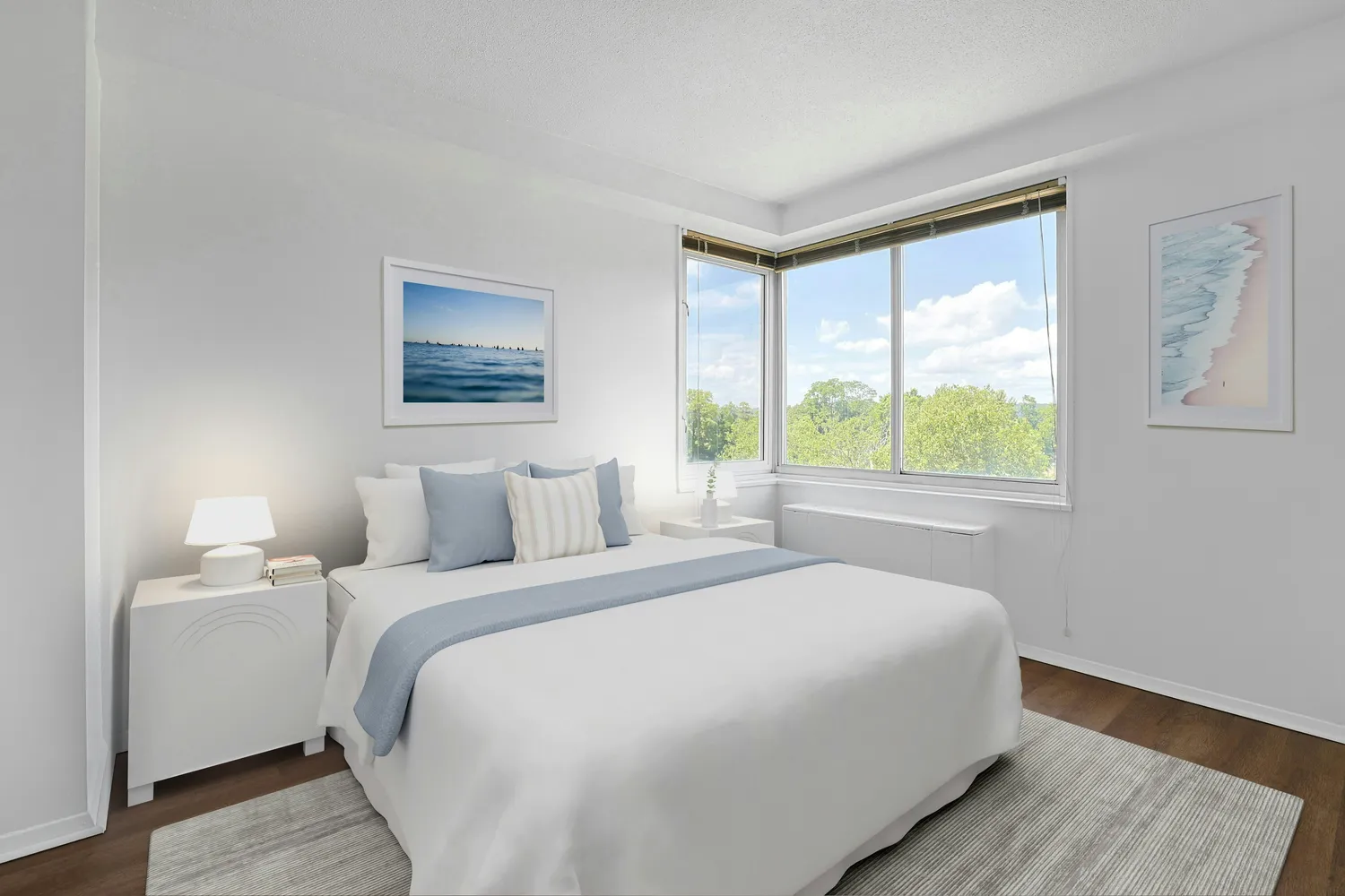 a bedroom with a large bed and a window