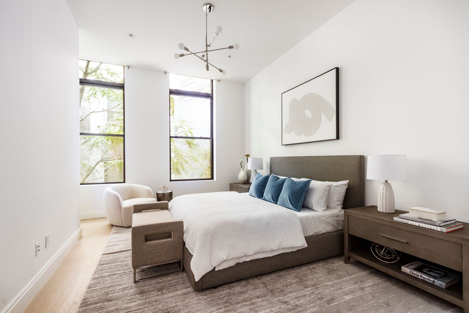 106 Franklin Street, Unit 2 Manhattan, NY 10013 - Photo 6 of 16 a bedroom with a bed and wooden floor