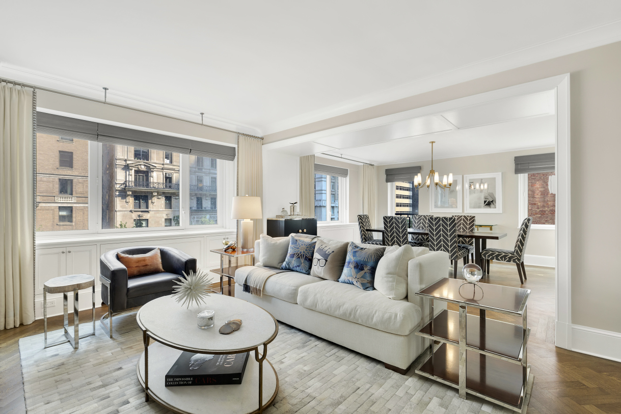 530 Park Avenue, Unit 4A Manhattan, NY 10065 - Photo 1 of 16 a living room with furniture and a large window