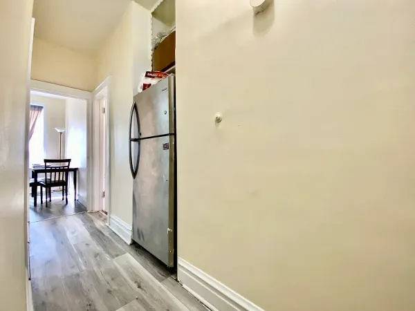 a view of hallway with wooden floor