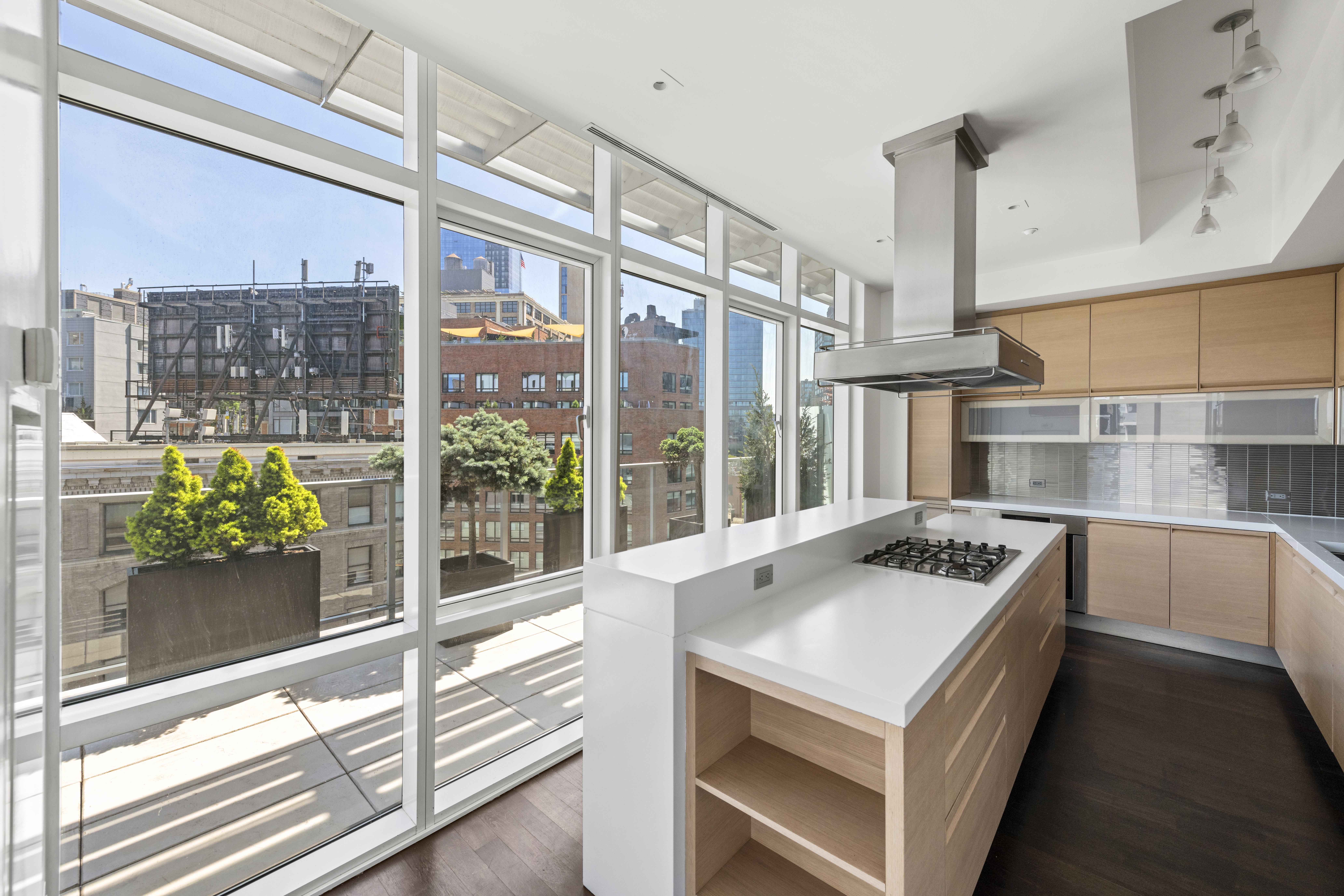 475 Greenwich Street, Unit PHN Manhattan, NY 10013 - Photo 7 of 28 a kitchen that has a stove and a table