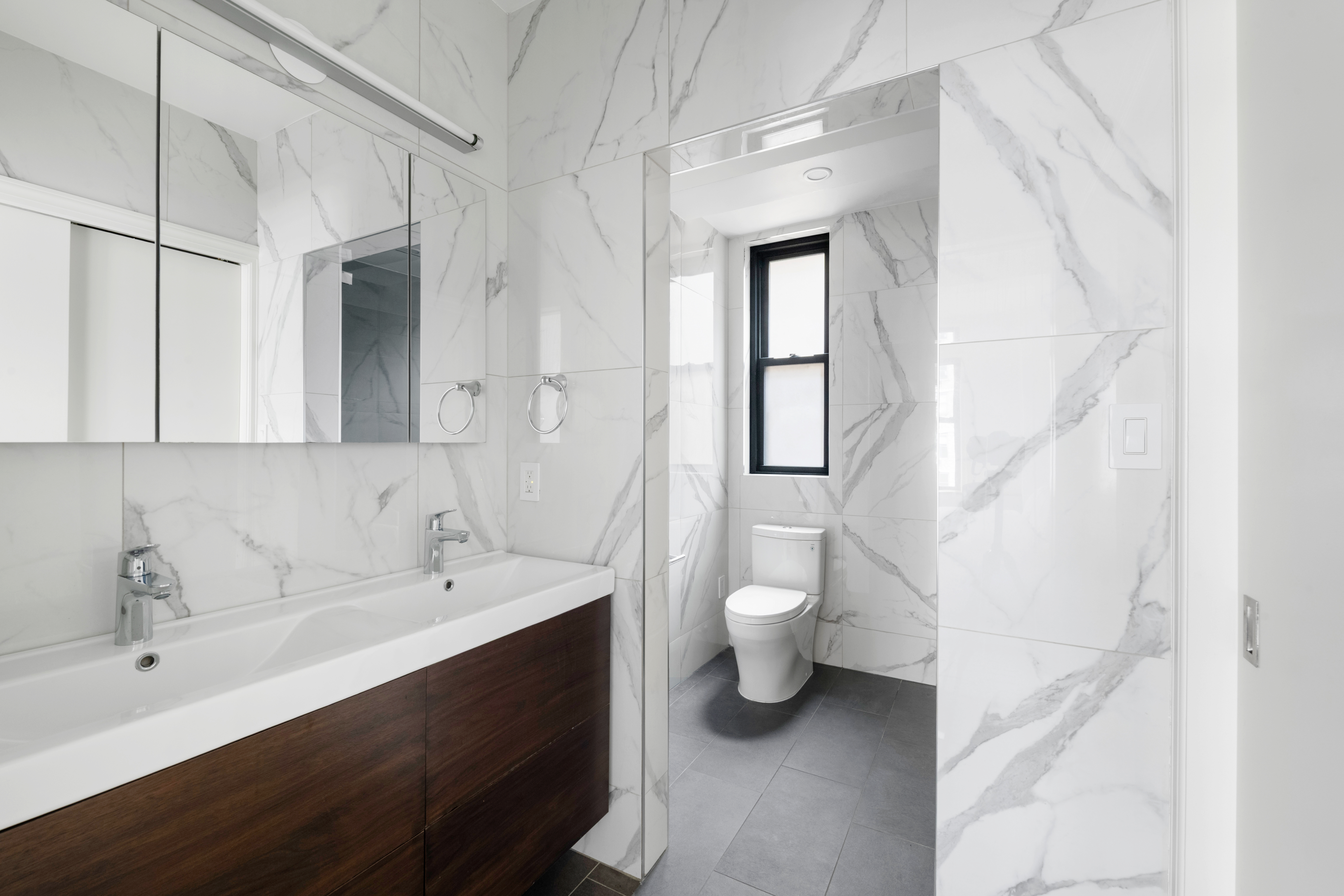 308 East 79th Street, Unit 13EF Manhattan, NY 10075 - Photo 7 of 16 a bathroom with a sink and a toilet