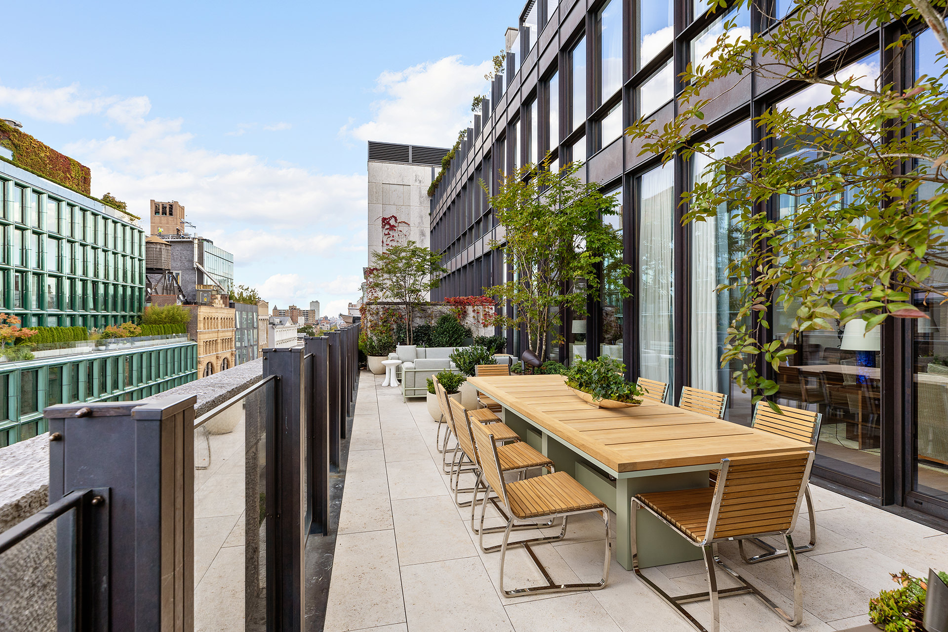 25 Bond Street, Unit PHW Manhattan, NY 10012 - Photo 3 of 34 a view of a patio with a table and chairs and potted plants