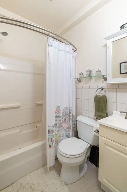 a bathroom with a toilet a sink and a bathtub