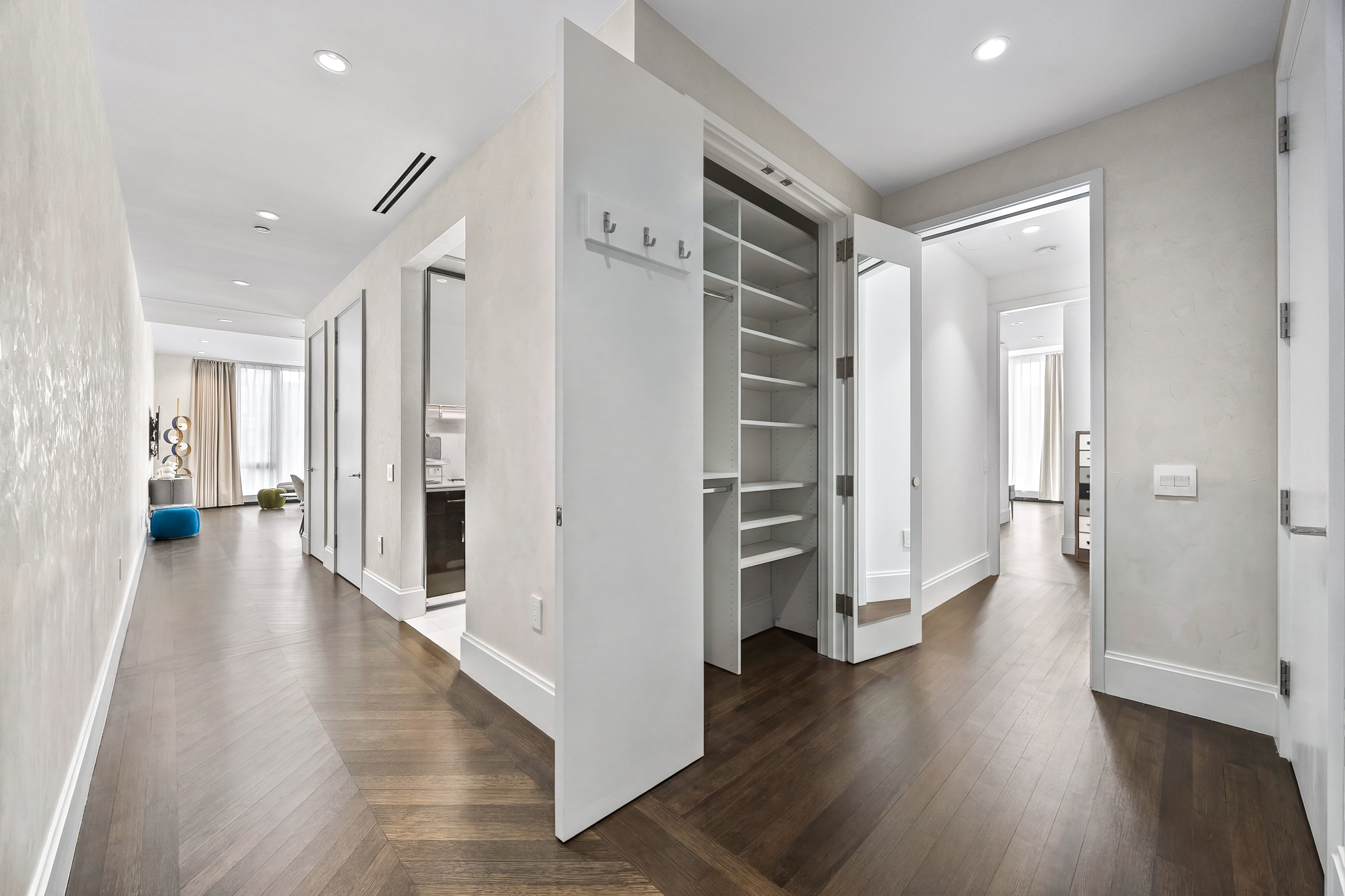 217 West 57th Street, Unit 36D Manhattan, NY 10019 - Photo 3 of 26 a view of a hallway with wooden floor