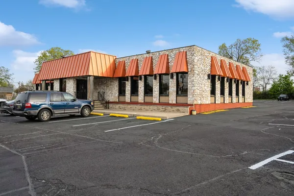 a view of a car parked in front of a house
