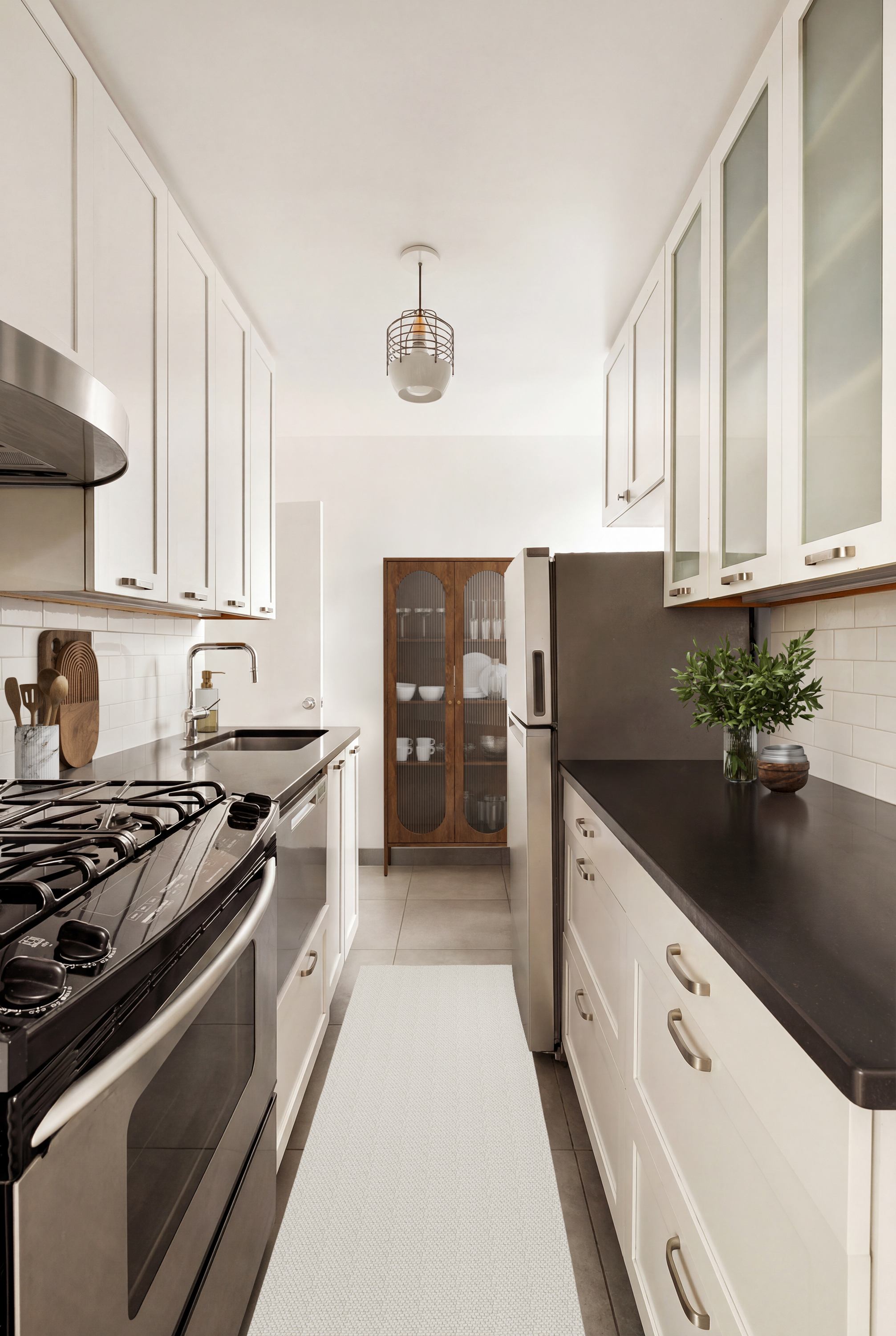 32 Gramercy Park South, Unit 5M Manhattan, NY 10003 - Photo 3 of 13 a kitchen with stainless steel appliances kitchen island granite countertop a stove a sink and a refrigerator