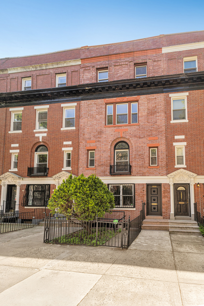 1050 Sterling Place Brooklyn, NY 11213 - Photo 22 of 23 a front view of a house with a garden