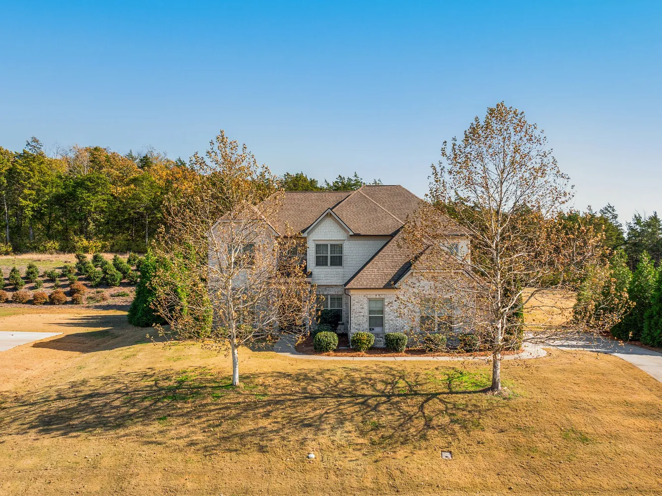 a front view of a house with a yard