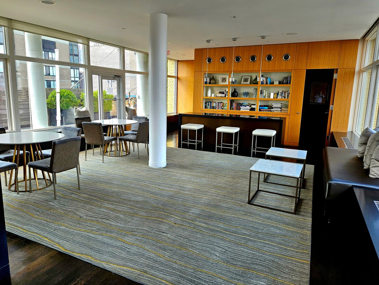 200 East 66th Street, Unit D1203 Manhattan, NY 10065 - Photo 18 of 24 a living room with furniture and wooden floor