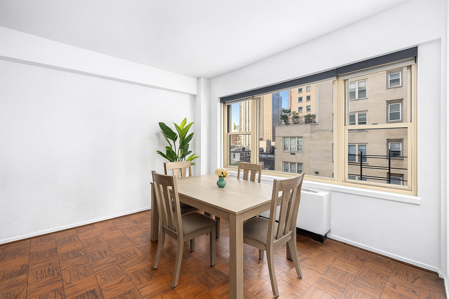 415 East 52nd Street, Unit 9AA Manhattan, NY 10022 - Photo 2 of 10 a view of a dining room with furniture window and outside view