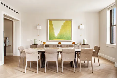 a view of a dining room with furniture and a window