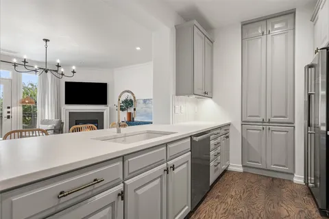a spacious bathroom with double vanity and a mirror