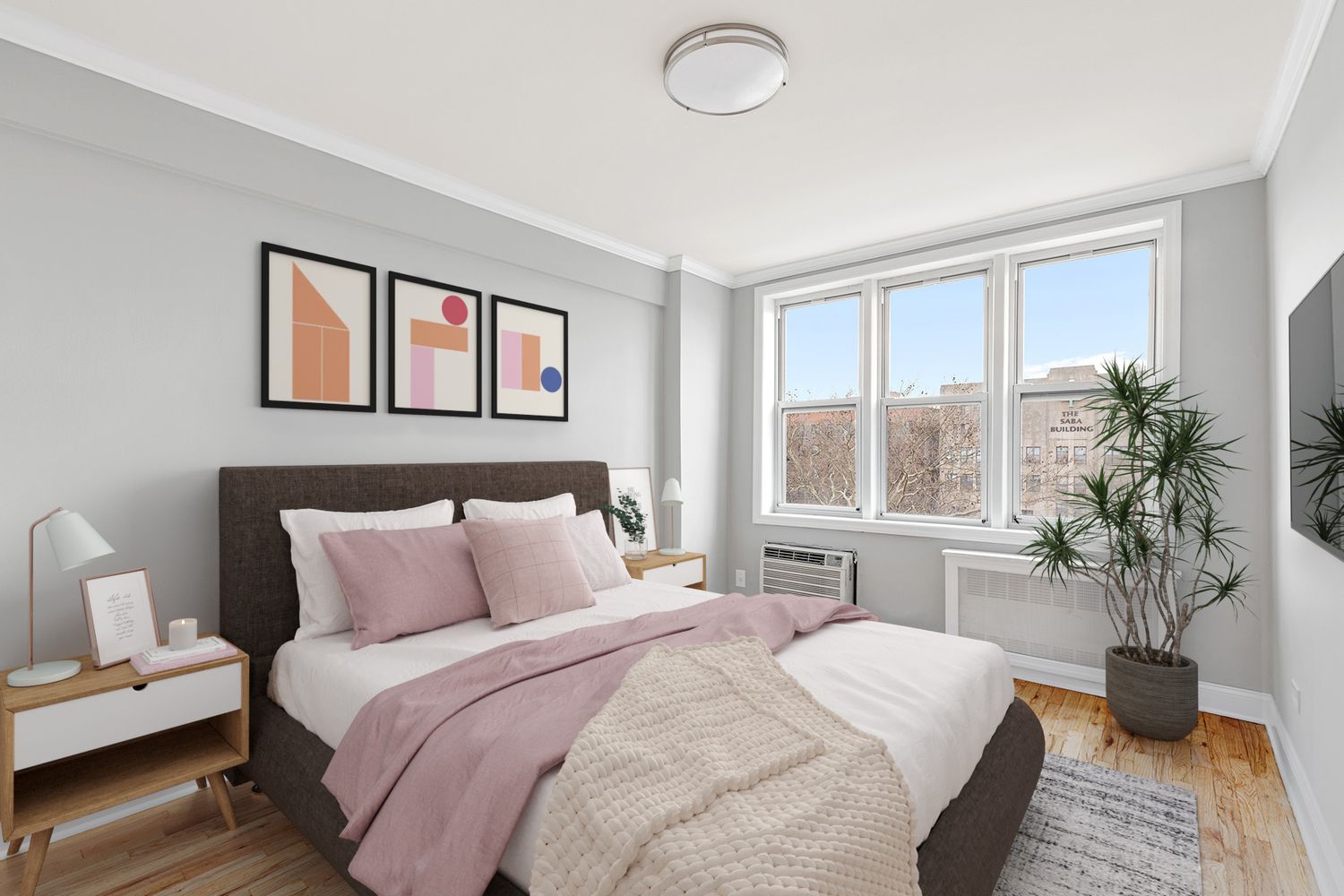 a bedroom with a bed and a large window