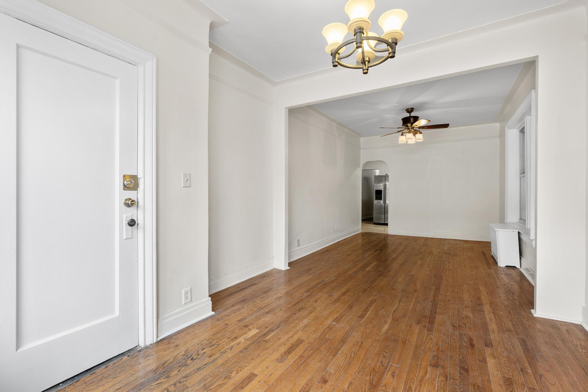 4513 Snyder Avenue Brooklyn, NY 11203 - Photo 2 of 13 a view of a room with wooden floor
