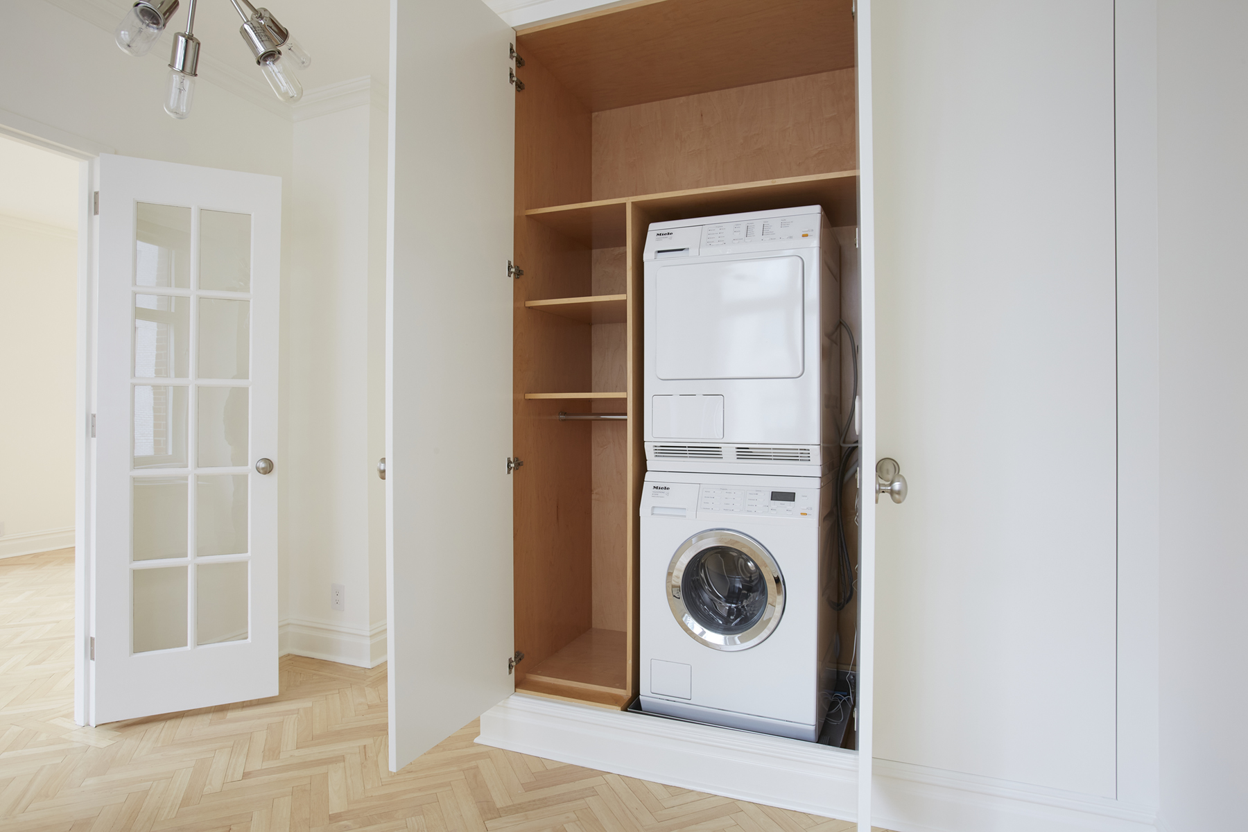 188 East 70th Street, Unit 8C Manhattan, NY 10021 - Photo 9 of 15 a utility room with dryer and washer