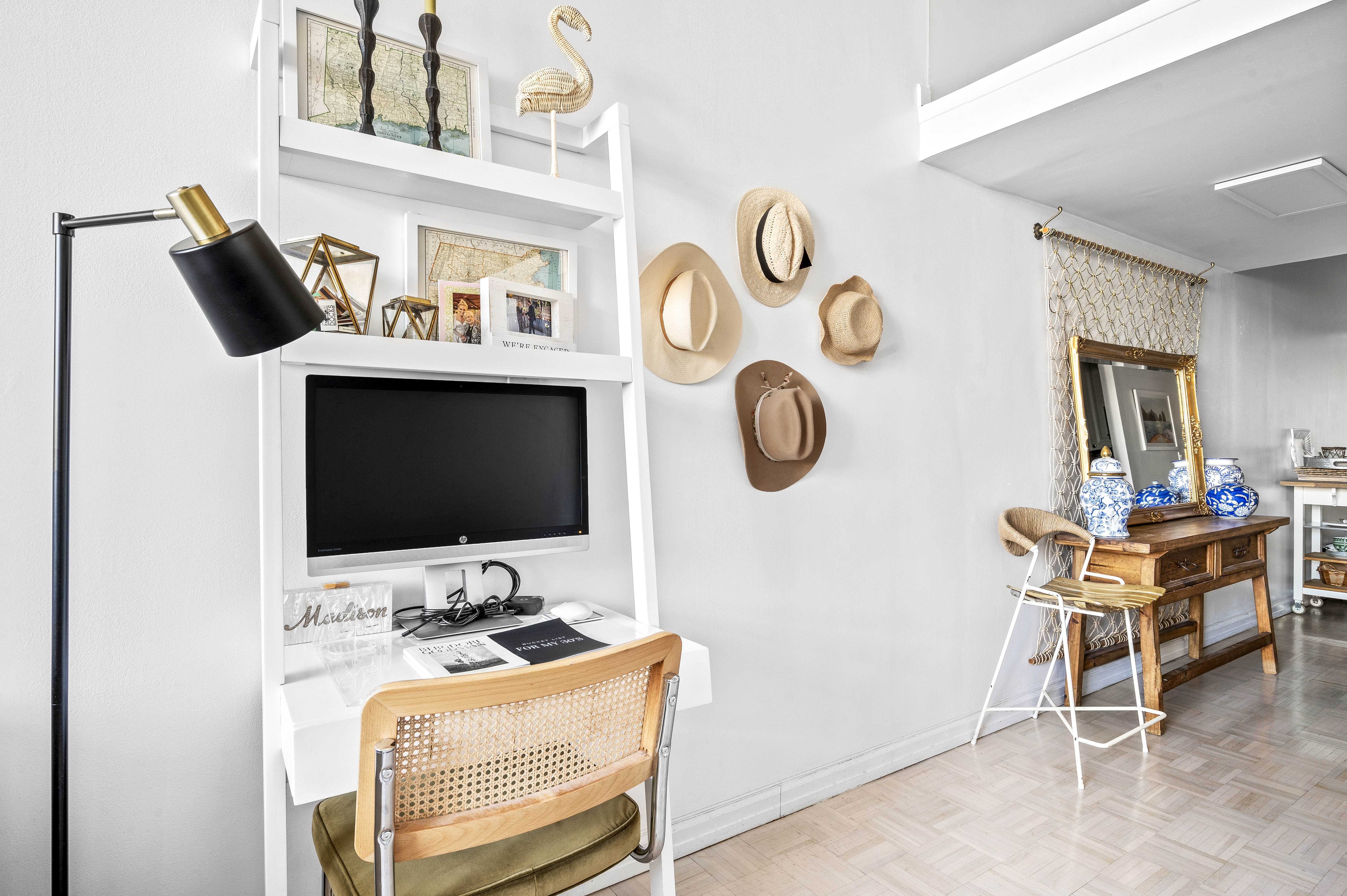 310 East 46th Street, Unit 19F Manhattan, NY 10017 - Photo 6 of 17 a view of a workspace with a flat screen tv