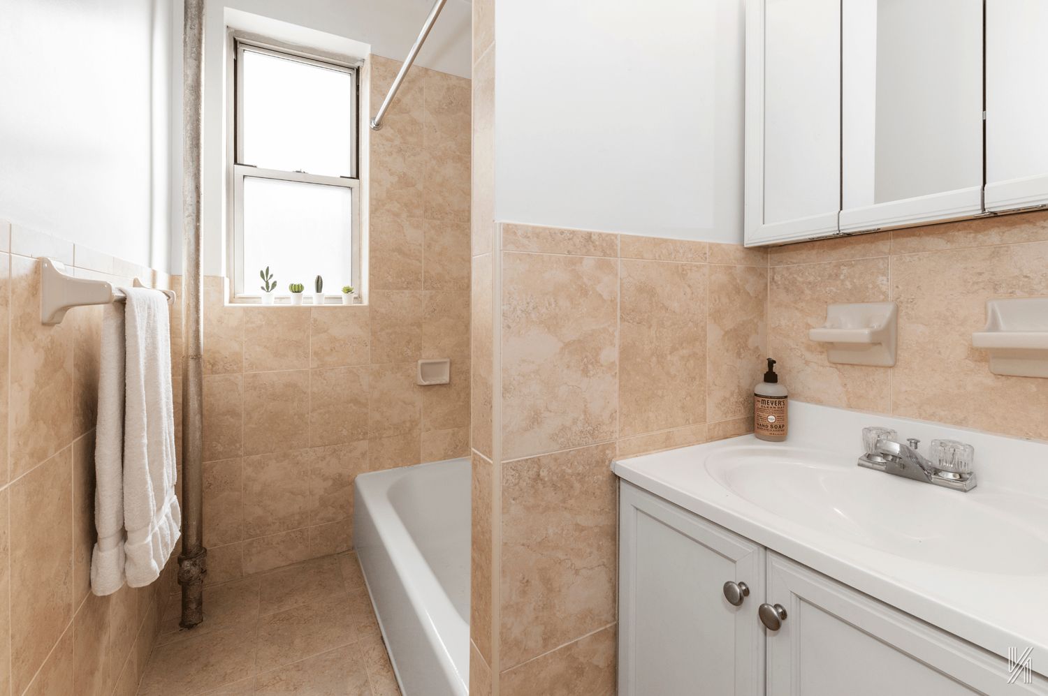 59-11 Queens Boulevard, Unit 3J Queens, NY 11377 - Photo 15 of 18 a bathroom with a sink and a shower