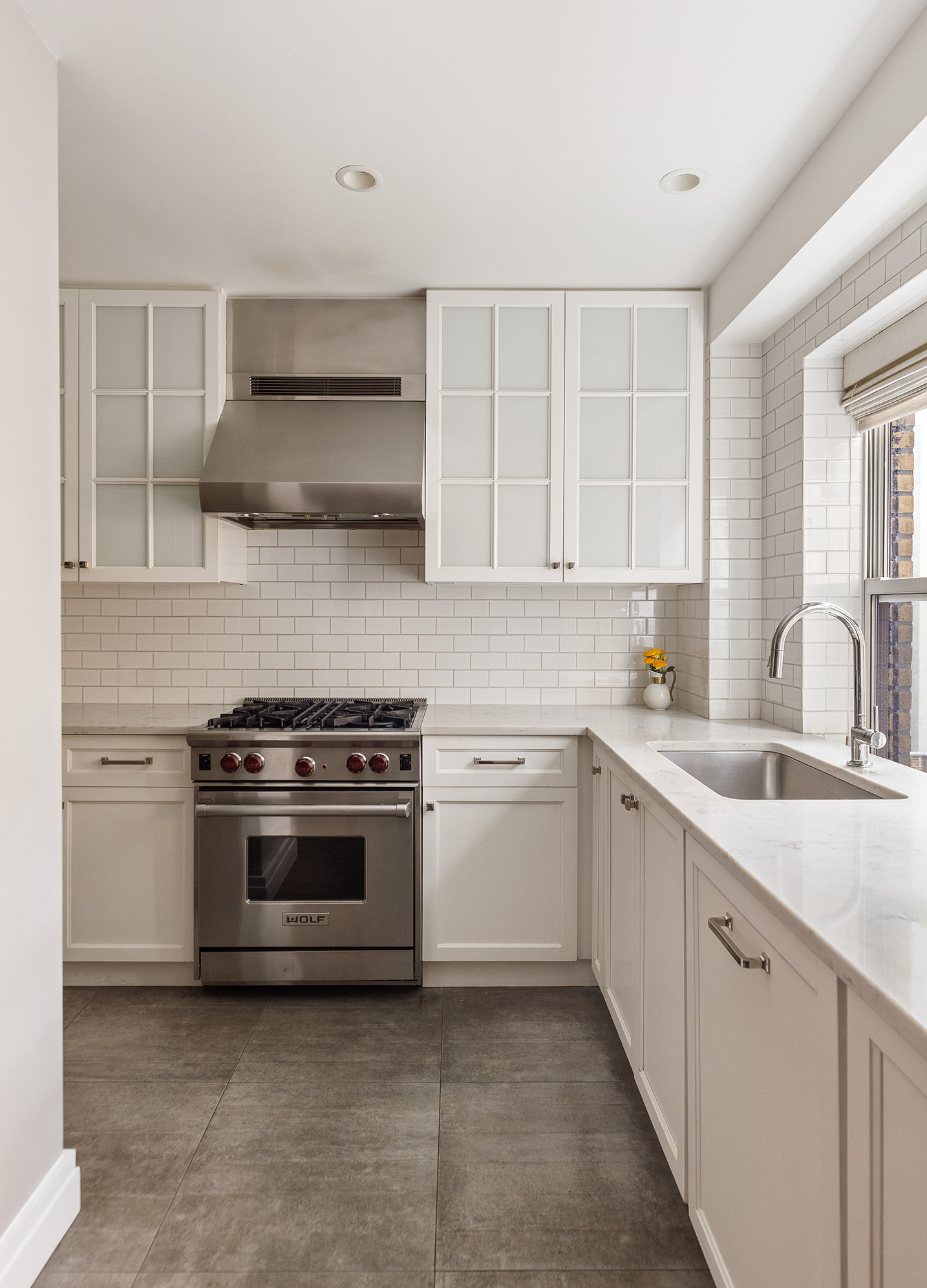 450 West End Avenue, Unit 3B Manhattan, NY 10024 - Photo 5 of 13 a kitchen with stainless steel appliances granite countertop a sink and a stove