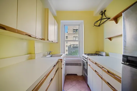 a room with a sink and a washer dryer
