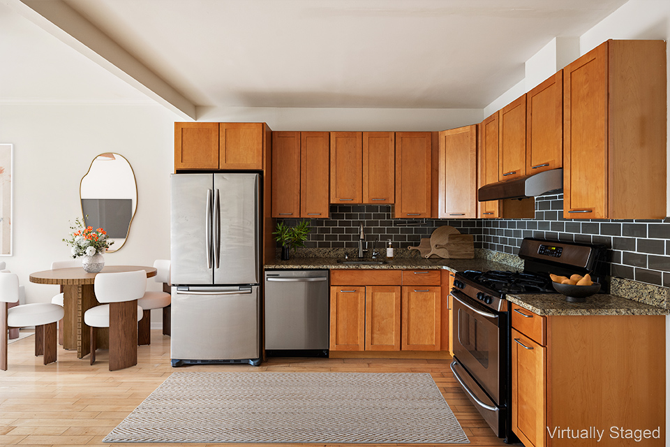 315 20th Street, Unit 3B Brooklyn, NY 11215 - Photo 4 of 9 a kitchen with stainless steel appliances granite countertop a refrigerator a stove a sink dishwasher and a microwave oven with wooden cabinets