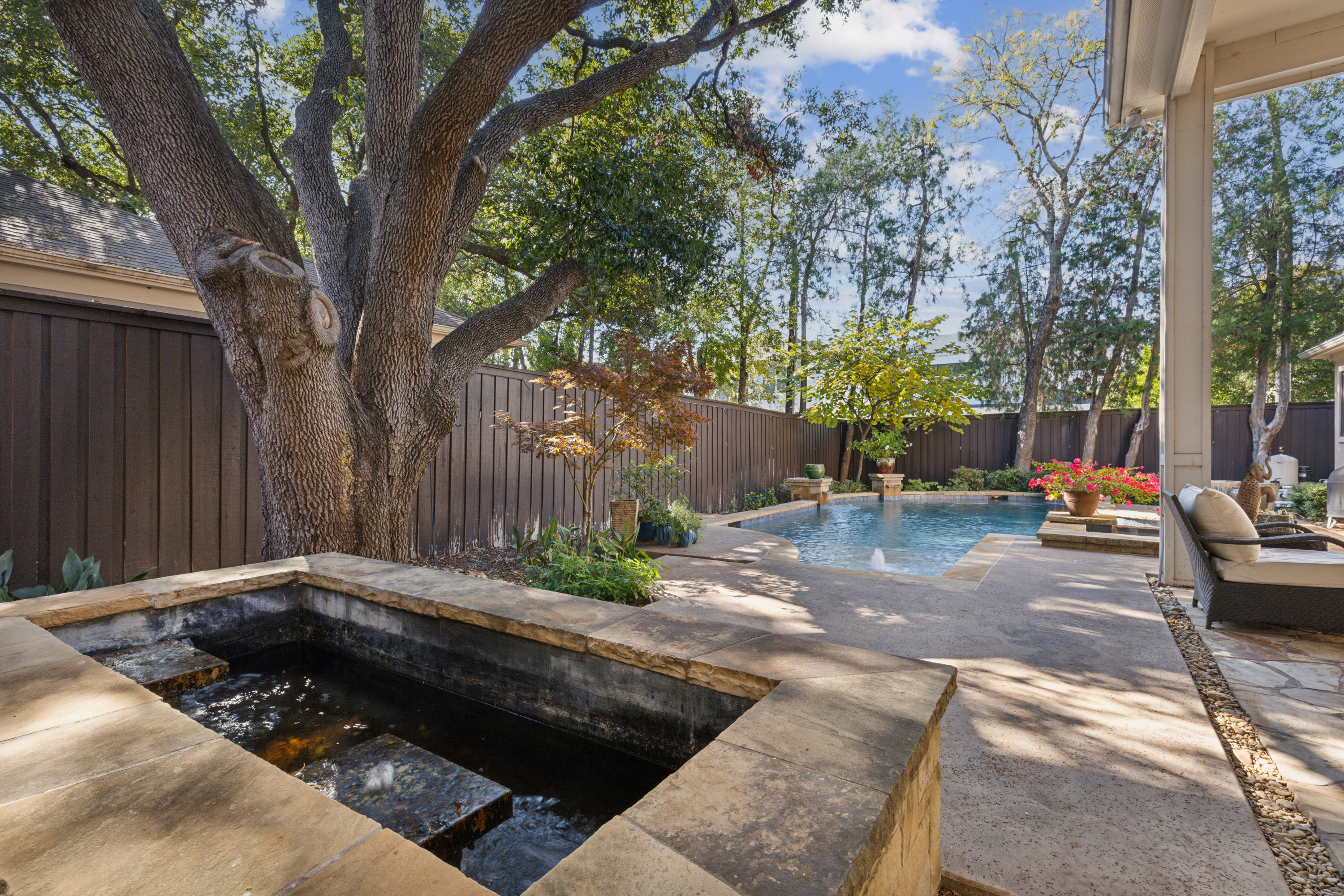 8411 Midway Road Dallas, TX 75209 - Photo 28 of 29 a view of a backyard with table and chairs and a fire pit