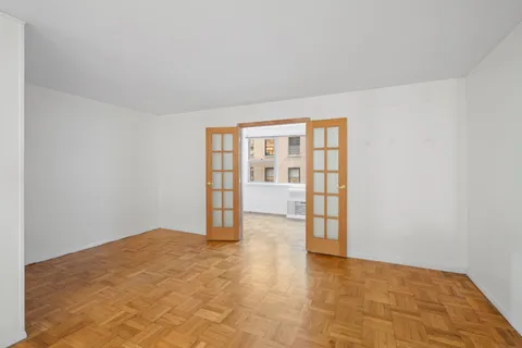 a view of an empty room with a window