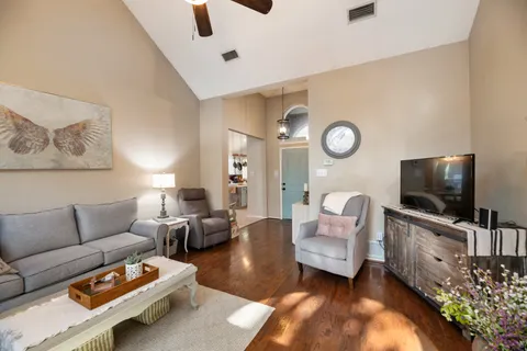a living room with furniture and a flat screen tv