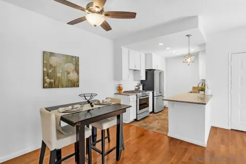 a kitchen with a table and chairs in it