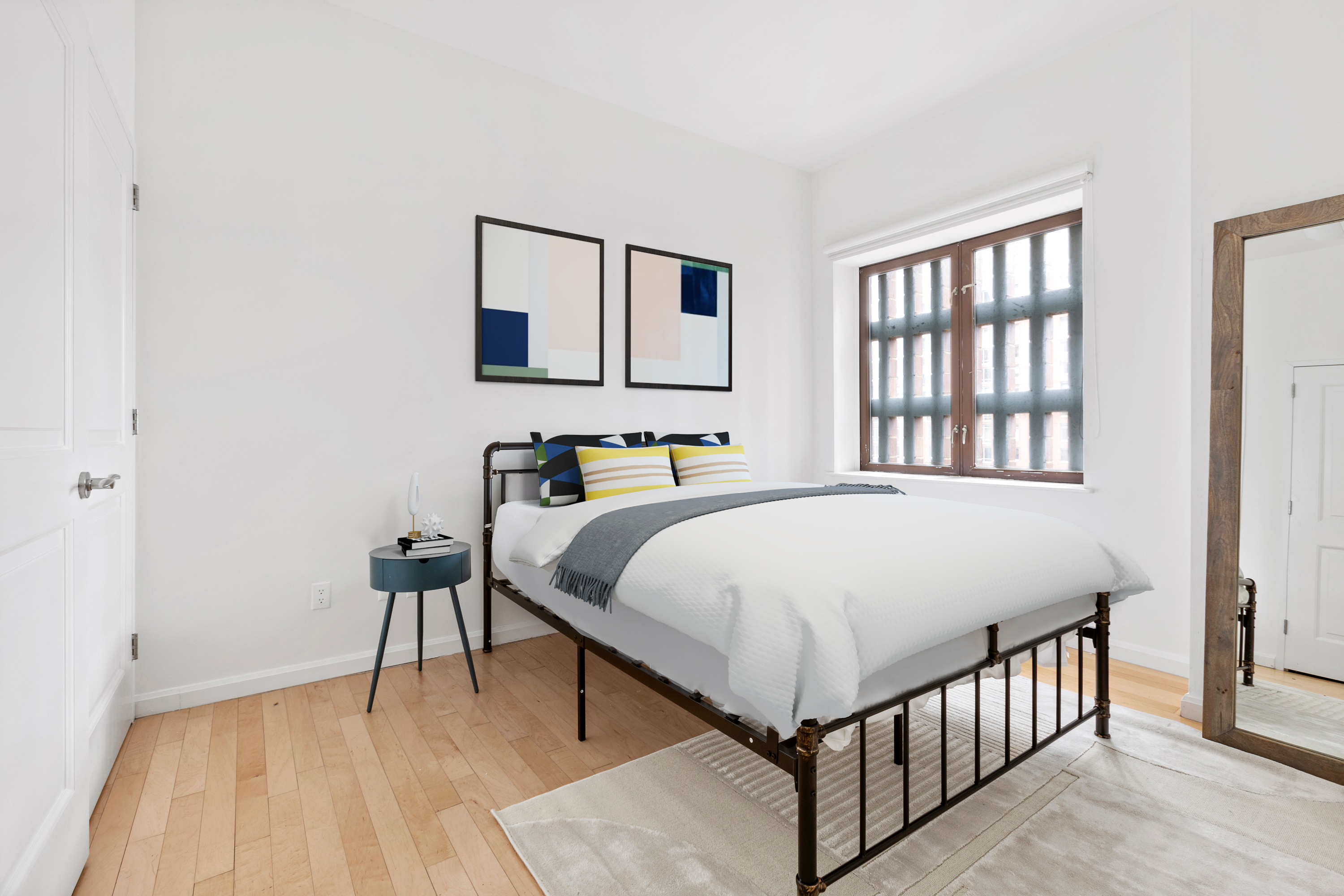 20 West Street, Unit 9A Manhattan, NY 10004 - Photo 3 of 14 a bedroom with a bed and a table