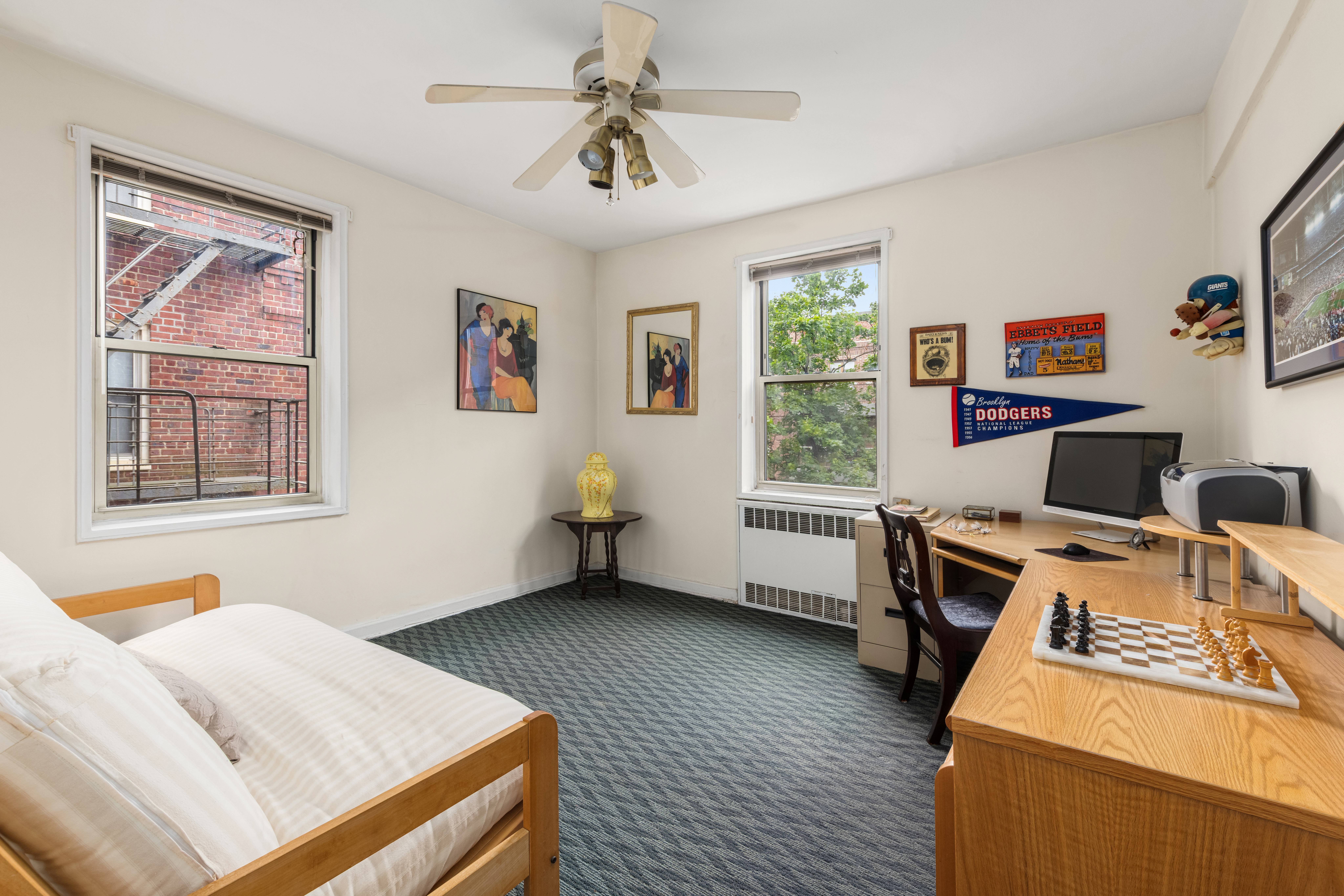 68-61 Yellowstone Boulevard, Unit 618 Queens, NY 11375 - Photo 7 of 13 a workspace with furniture and window