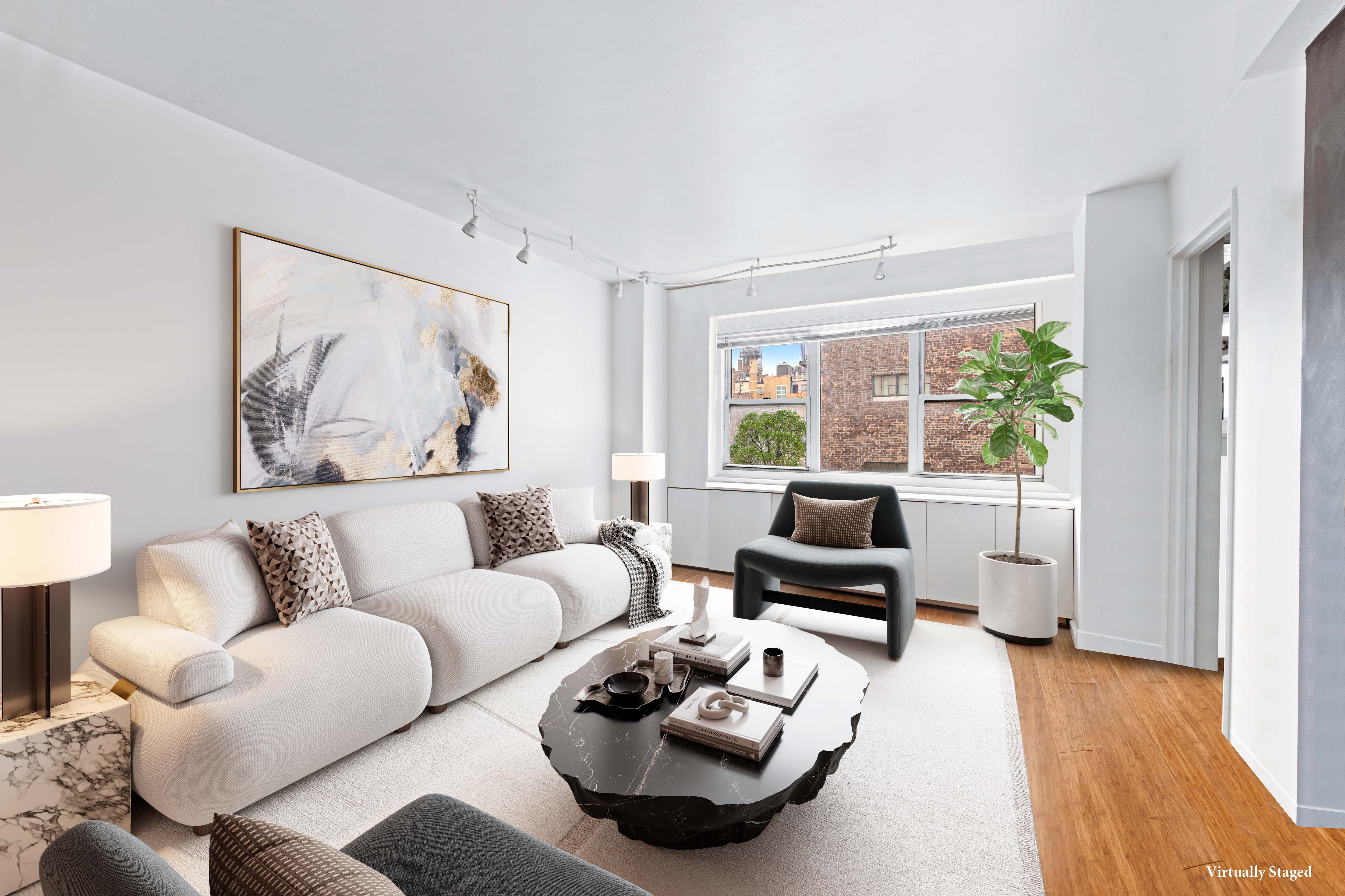 69 West 9th Street, Unit 9H Manhattan, NY 10011 - Photo 1 of 6 a living room with furniture and a large window