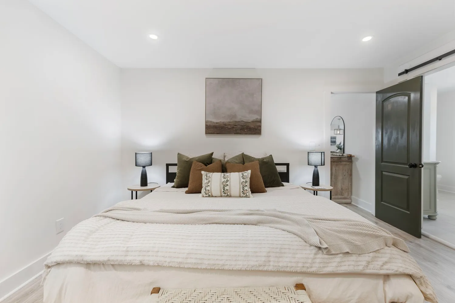 a spacious bathroom with a double vanity sink and a mirror