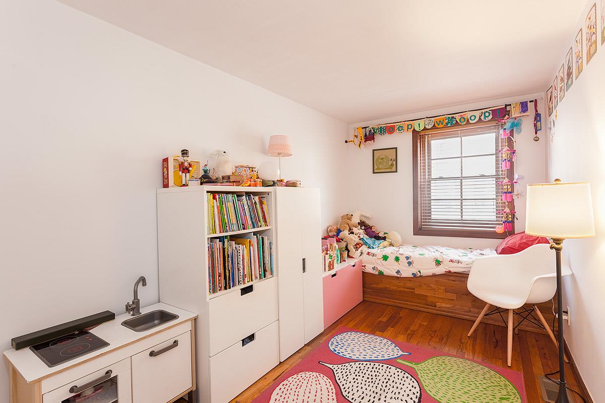 404 13th Street, Unit 1 Brooklyn, NY 11215 - Photo 5 of 7 a livingroom with furniture and toys