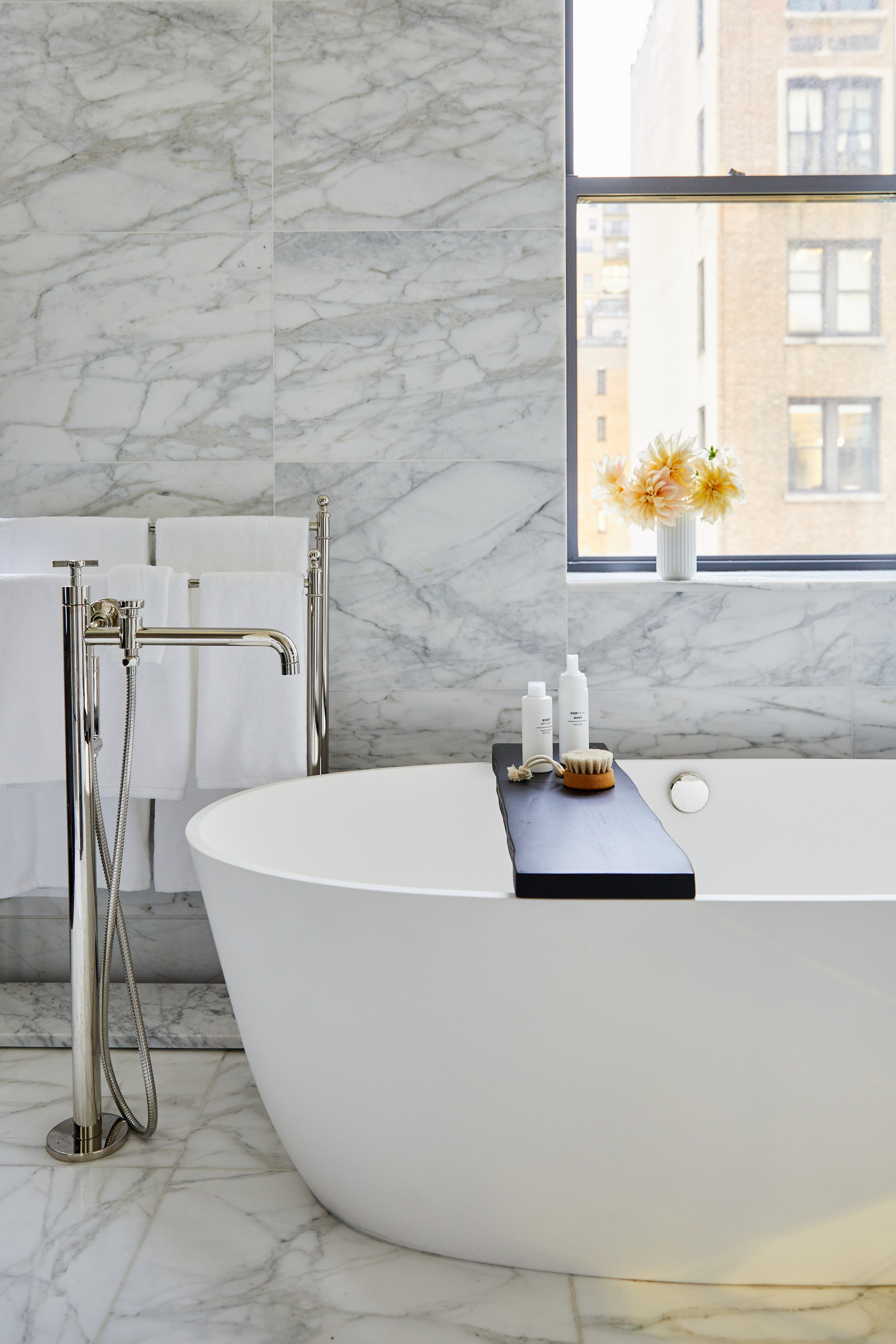 235 West 75th Street, Unit 505 Manhattan, NY 10023 - Photo 9 of 23 a white bath tub sitting next to a window