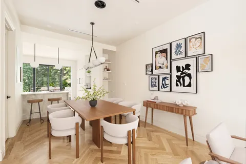 a dining room with furniture and window
