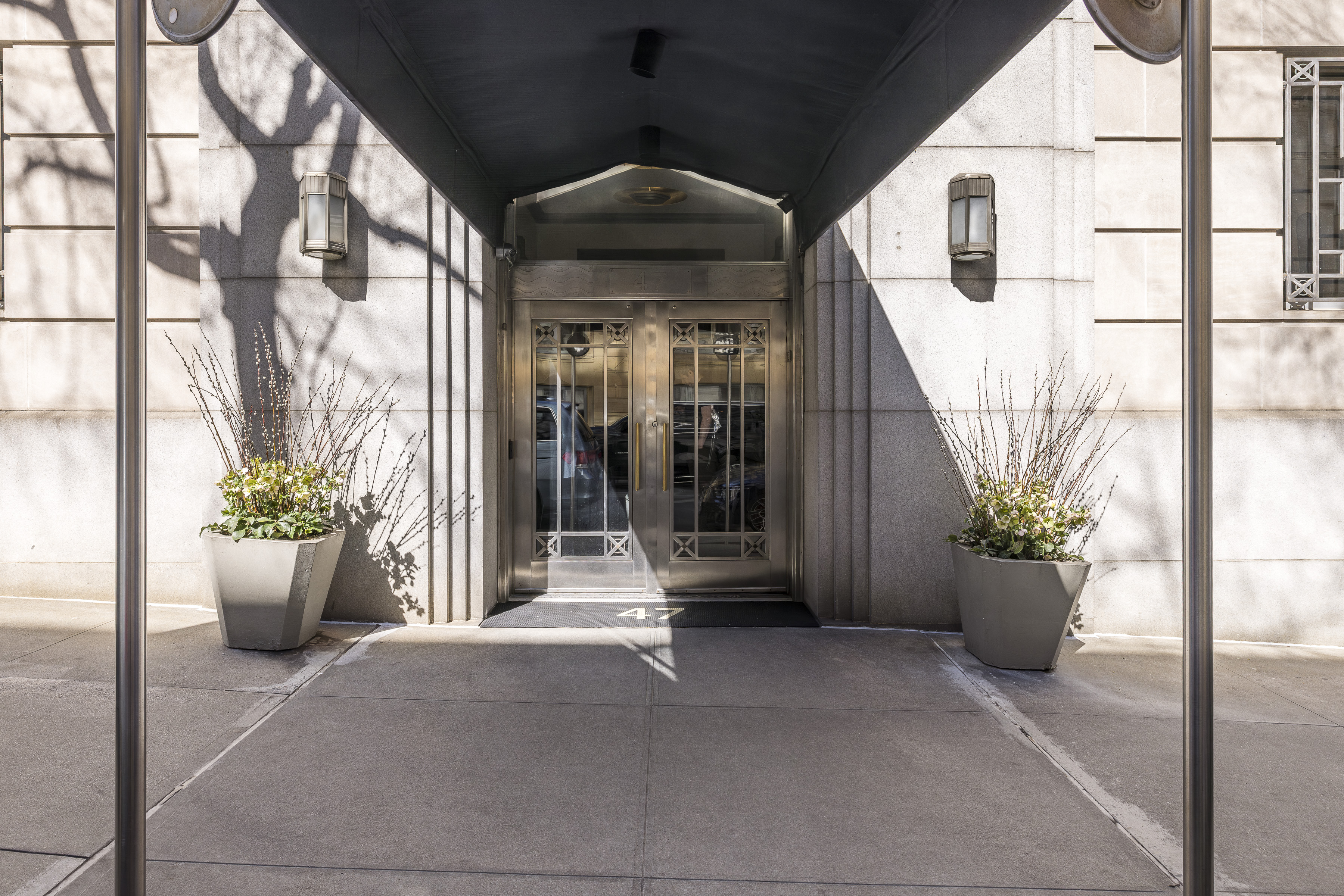 47 East 87th Street, Unit 7A Manhattan, NY 10128 - Photo 20 of 22 a view of a path along with potted plants