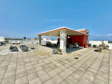 a view of a balcony with chairs