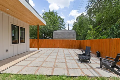 a backyard of a house with seating space